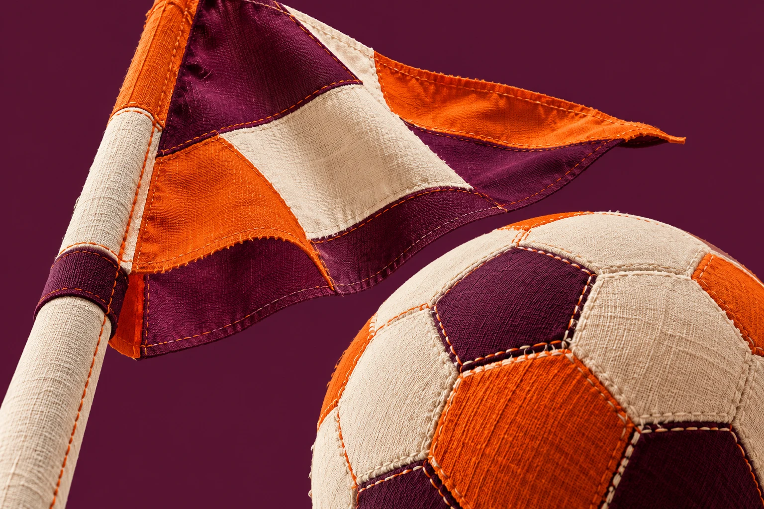 Collage textil IA de un banderín y un balón genéricos en campo imaginario, sin jugadores, líneas de fuera de juego, marcador o partido real.